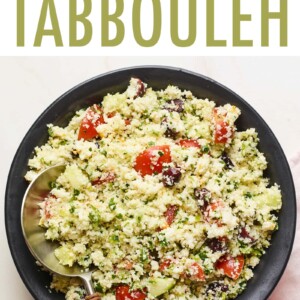 Serving bowl of cauliflower tabbouleh with a serving spoon.