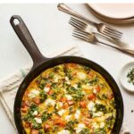 Sweet potato kale goat cheese frittata in a skillet.