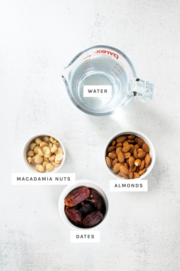 Water, macadamia nuts, almonds and dates measured out.