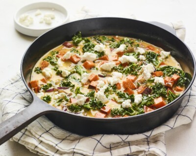 Kale frittata in a skillet before being baked.