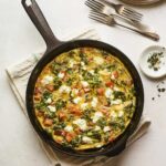 Sweet potato kale goat cheese frittata in a skillet.