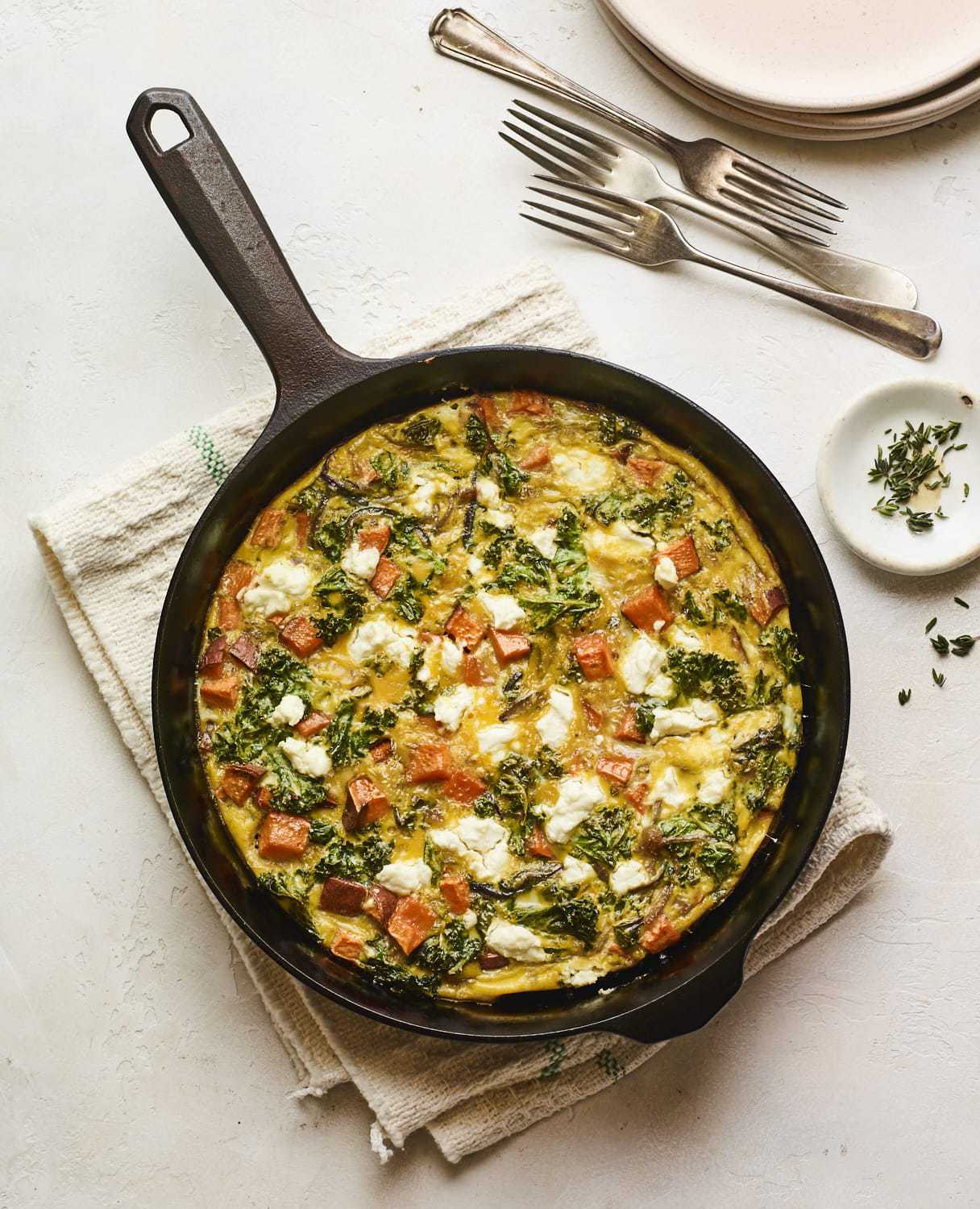 Sweet potato kale goat cheese frittata in a skillet.