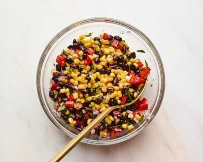 Mixing bowl with black bean and corn salad.