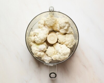 Cauliflower florets in a food processor.