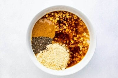 Ingredients to make coffee overnight oats in a bowl.