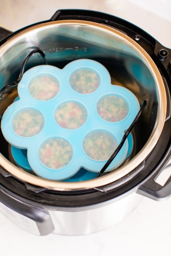 Egg white bites in a mold that's inside an instant pot.