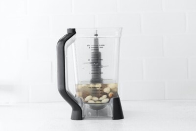 Blender with water, soaked nuts and dates.