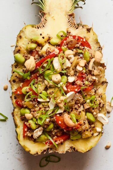 Pineapple boat full of pineapple fried quinoa.