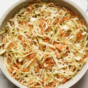 Serving bowl of apple cider vinegar coleslaw.