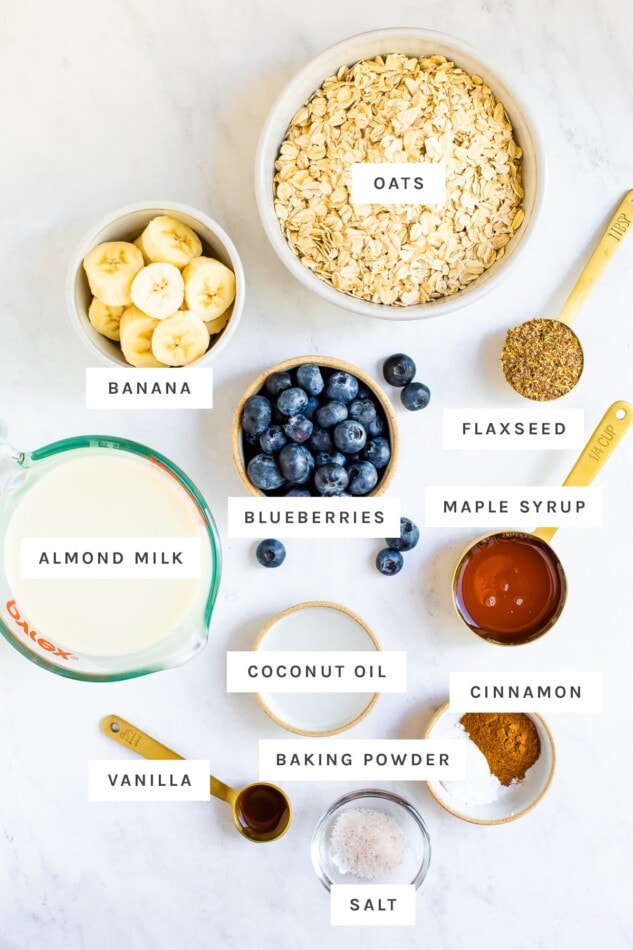 Oats, blueberries and other ingredient measured out to bake blueberry baked oatmeal.