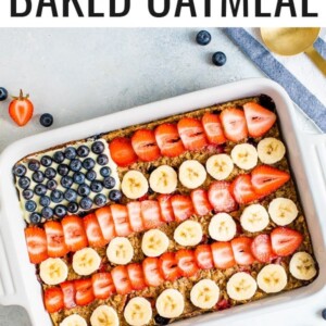 Baked oatmeal decorated to look like the American flag with blueberries, banana slices and strawberries.