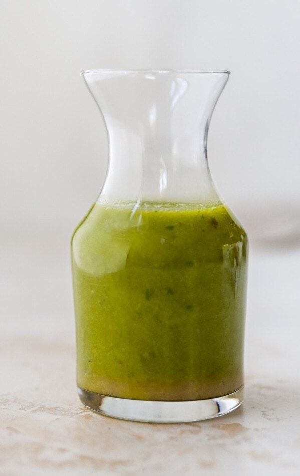 Jar of basil vinaigrette.