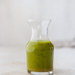 Jar of basil vinaigrette.