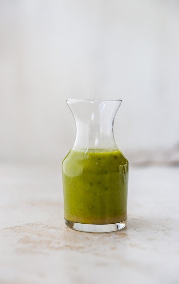 Jar of basil vinaigrette.