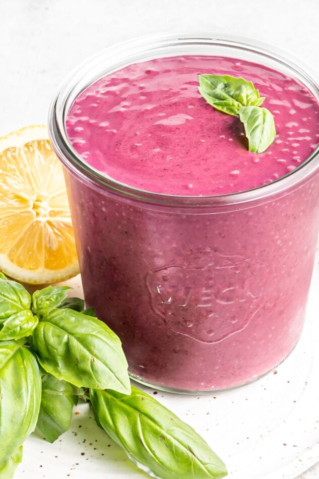 Blueberry weight loss smoothie with basil on top in a glass Weck Jar.