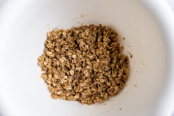 Oatmeal pecan crumble topping mixture in a bowl.