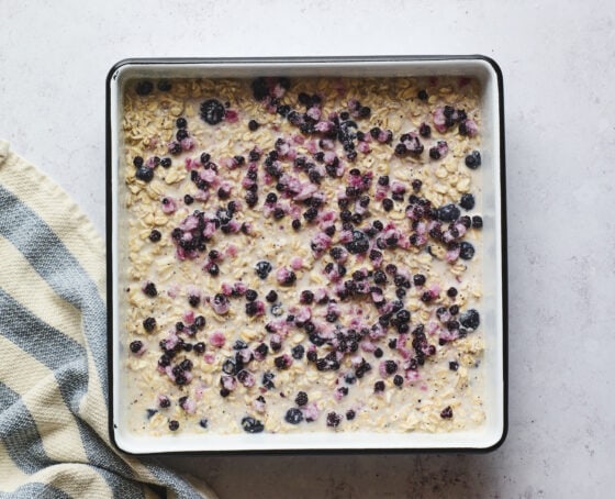 Mixture for blueberry lemon baked oatmeal in a baking dish before being baked.