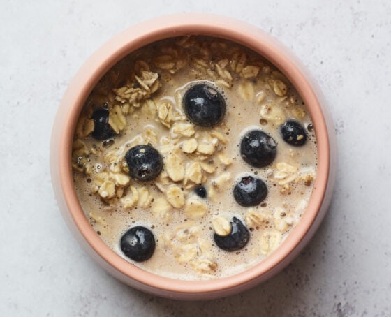 Bowl of blueberry baked oatmeal mixture before being baked.