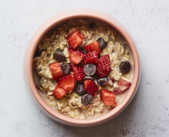 Strawberry chocolate chip baked oatmeal in a bowl before being baked.