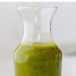 Jar of basil vinaigrette.