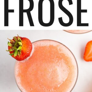 Glass of frose garnished with a strawberry.