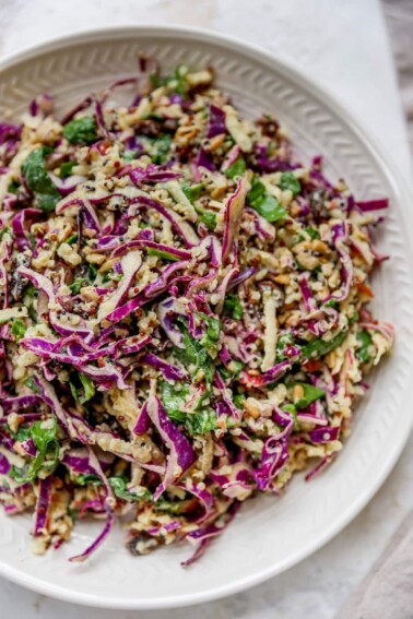 Apple slaw plated on a white plate.