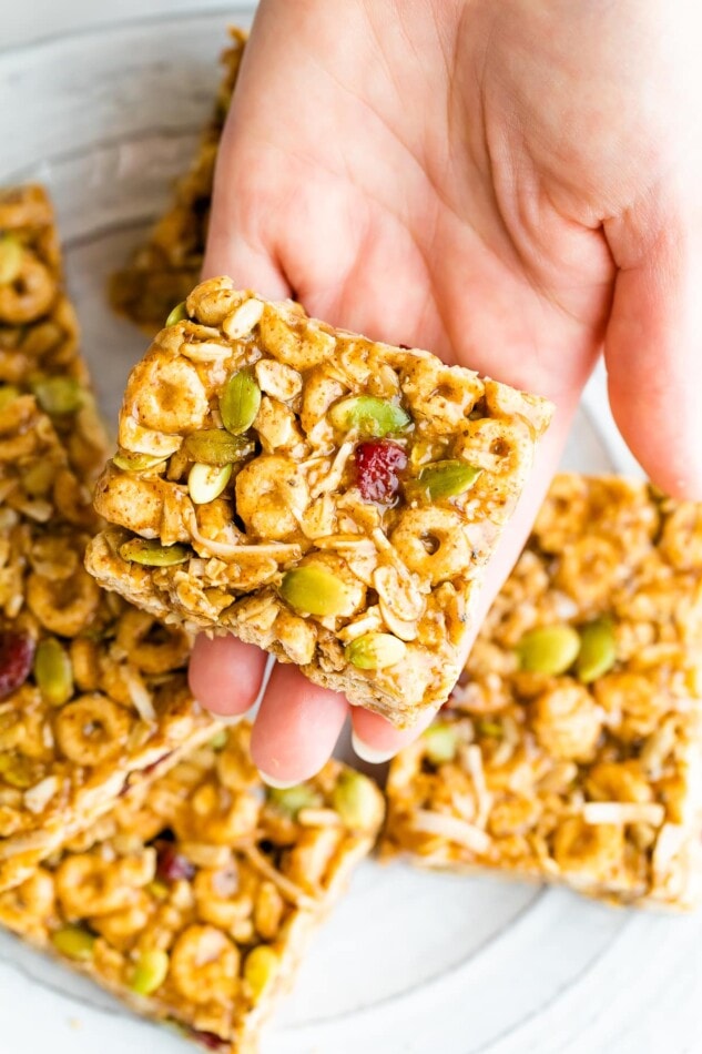 Hand holding a cereal bar.