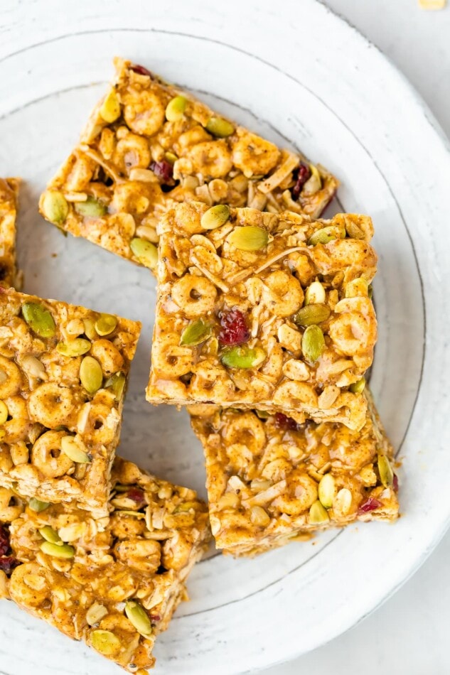 Cereal bars stacked on a plate.