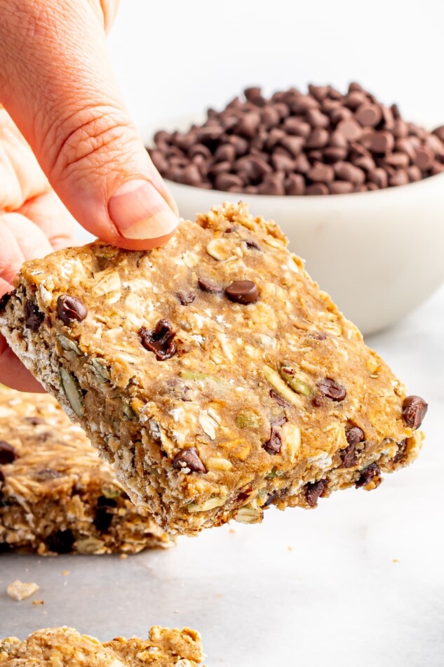 Hand holding an oatmeal breakfast bar.