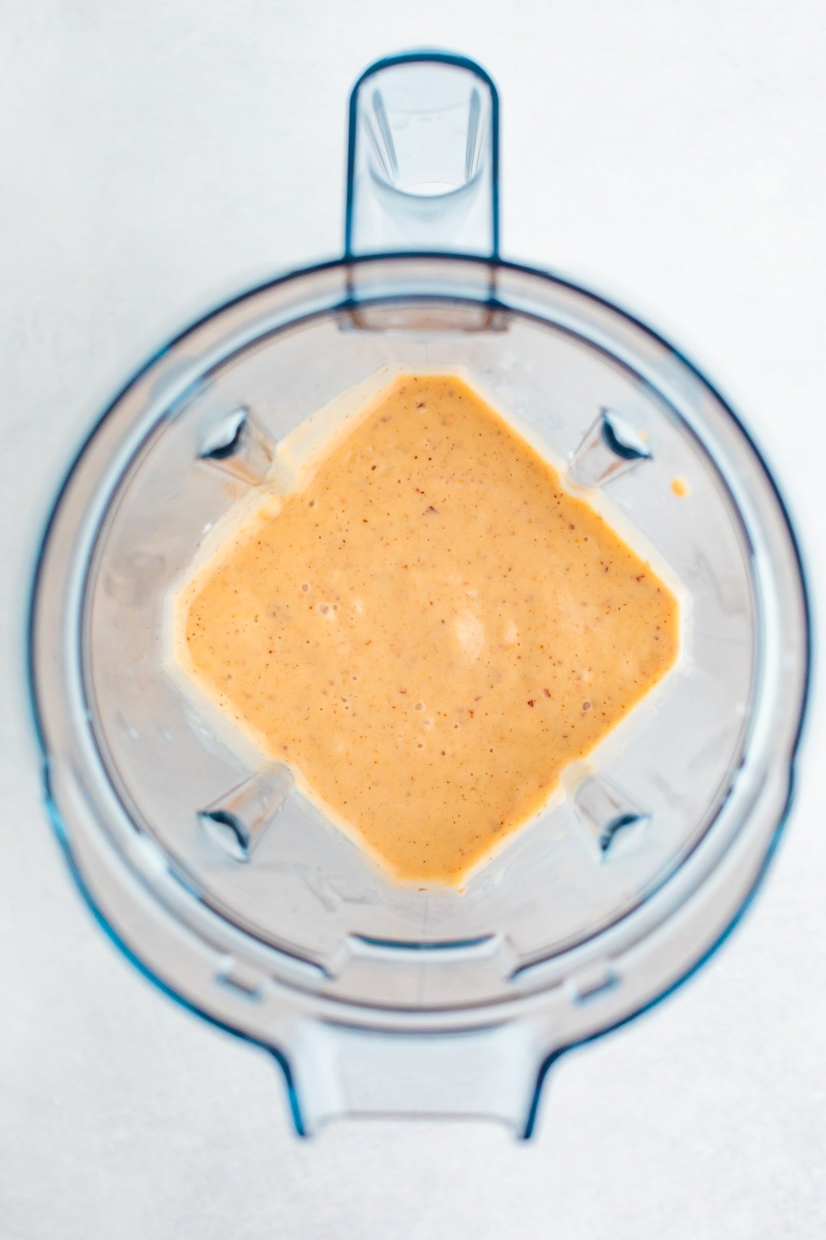 Blender with peach smoothie.