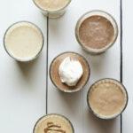 Bird's eye photo of 6 different protein shakes.