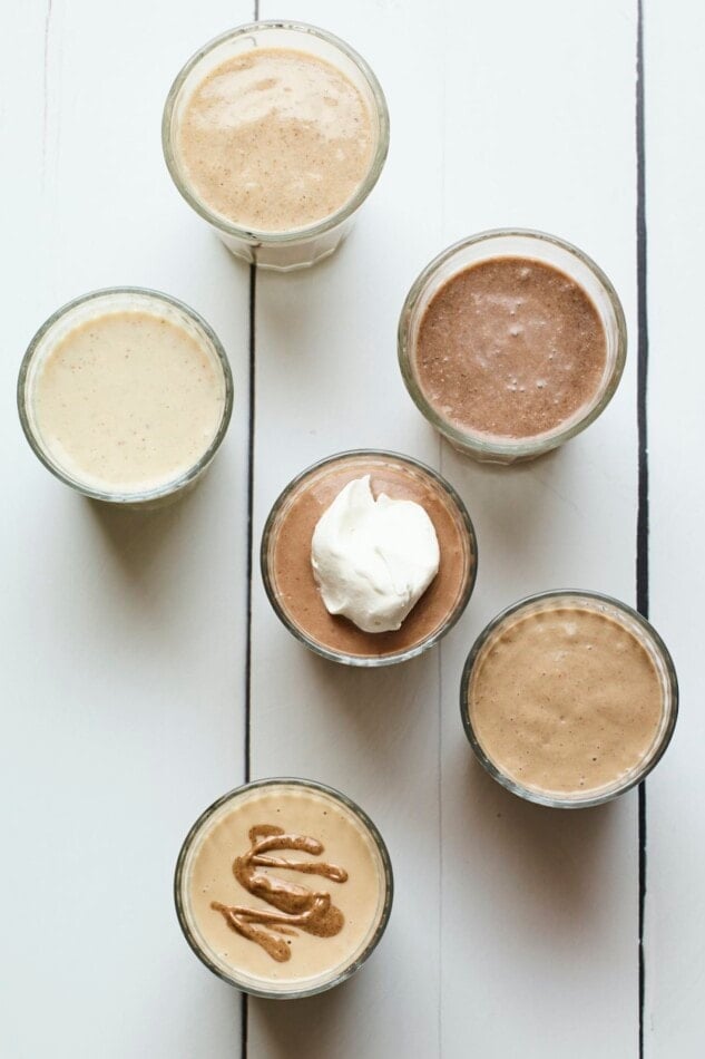 Bird's eye photo of 6 different protein shakes.