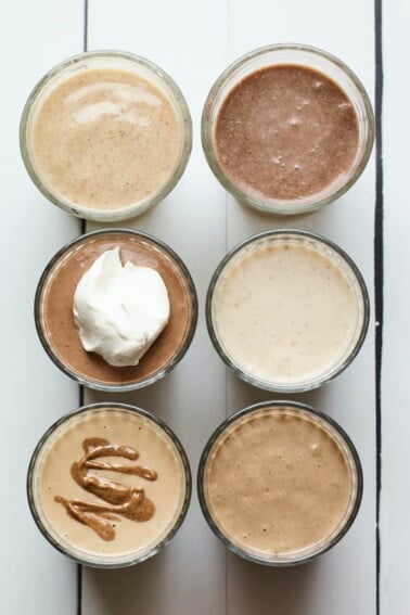 Bird's eye photo of 6 different protein shakes.