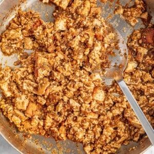 Sofritas in a skillet with a spoon.