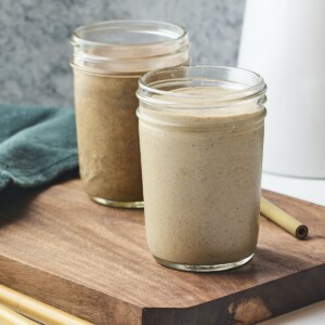 Vegan protein shakes in two mason jars.