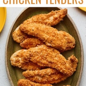 Overhead shot of a serving platter with baked chicken tenders.