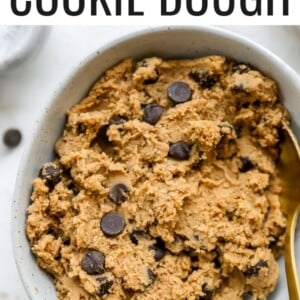 Bowl of protein chocolate chip cookie dough with a spoon.