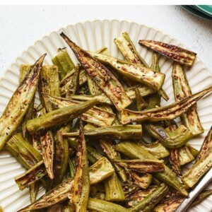 Roasted okra on a plate.