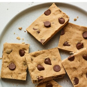 Peanut butter chocolate chip protein bars on a plate.