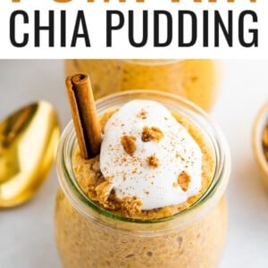 Pumpkin chia pudding in a tulip weck jar, topped with coconut whipped cream, granola and a cinnamon stick.
