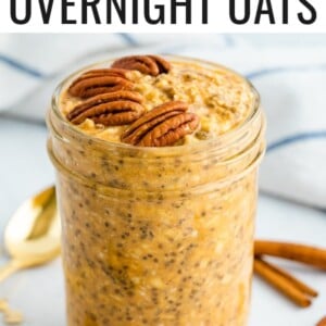 Jar of pumpkin pie overnight oats topped with pecans.