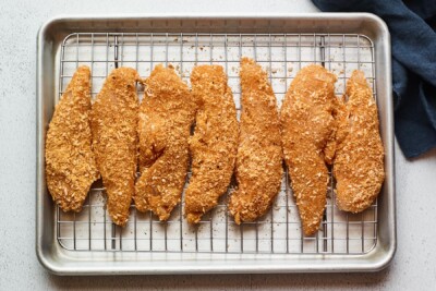 Overhead shot of chicken tenders on a baking sheet.