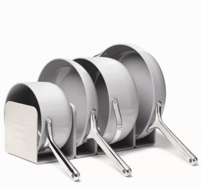 Various sized pots and pans set in a magnetic rack for storage
