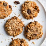 Overhead shot of a plate with five carrot cake breakfast cookies.