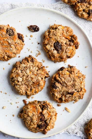 Overhead shot of a plate with five carrot cake breakfast cookies.