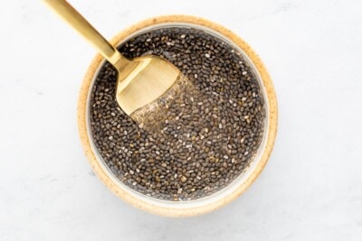 Mixing chia seeds and water together to make a chia seed egg.