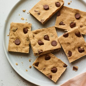 Chocolate chip peanut butter protein bars on a plate.