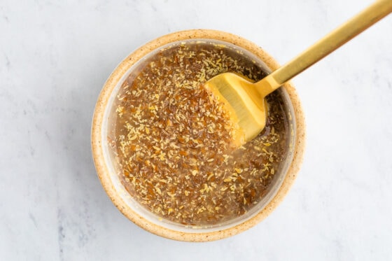 A fork mixing ground flax and water together.