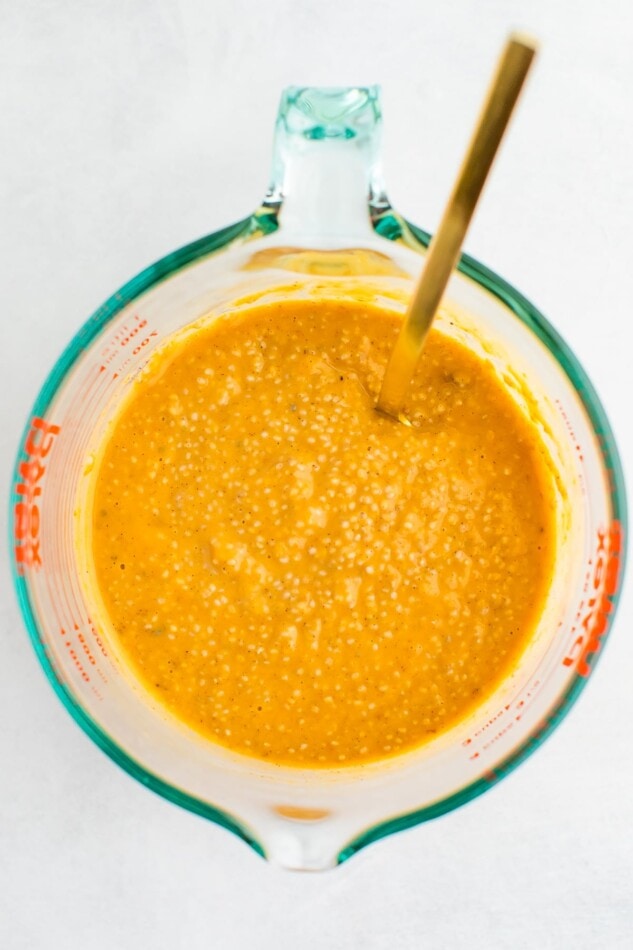 Pumpkin chia pudding mixed in a glass pyrex measuring cup.