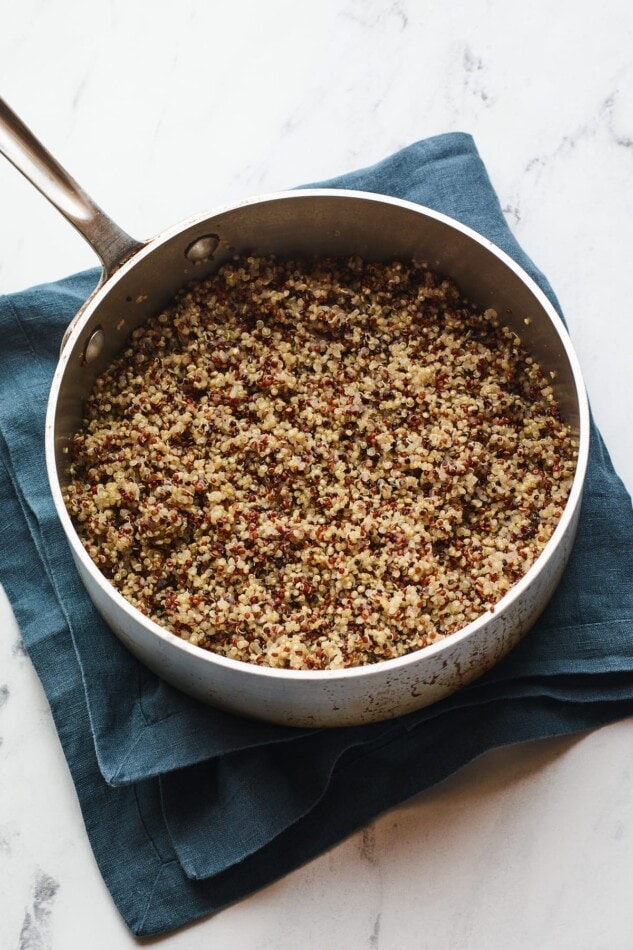 A saucepan with cooked quinoa.